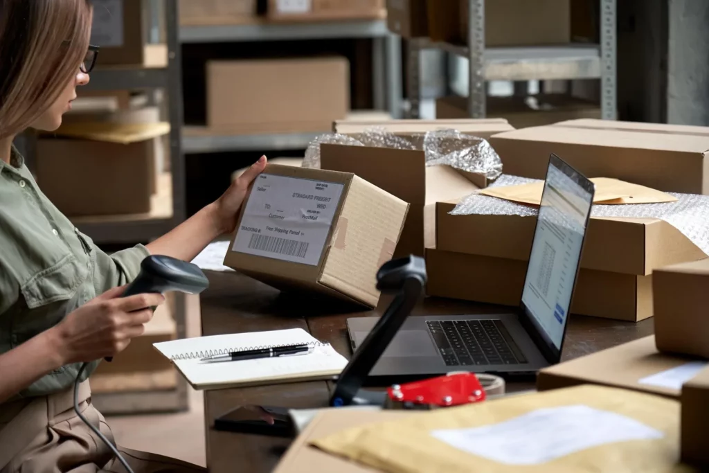 Business Courier, staff scanning parcels 