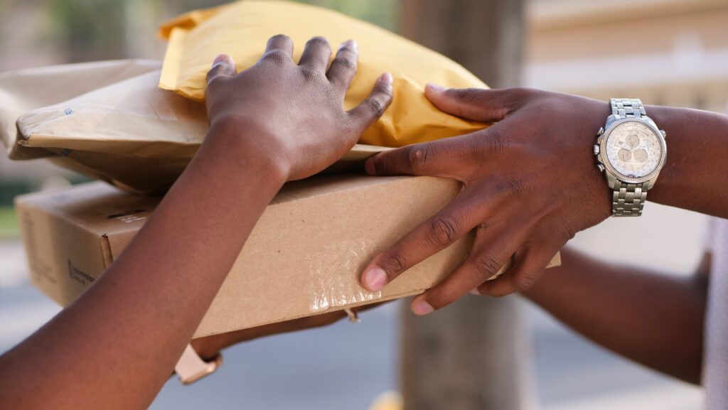 Close up picture of Parcel exchanging hands